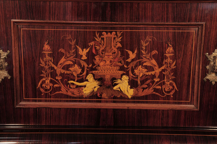 Ascherburg front panel inlaid with a central lyre flanked by two reclining femal figures, scrolling acanthus, hibiscus, birds and torches in a variety of woods
