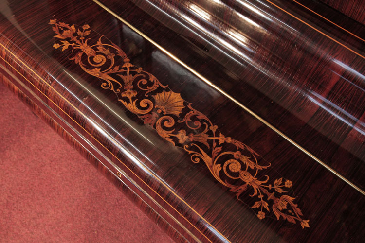Ascherburg piano fall inlaid with a central shell surrounded by scrolling hibiscus, acanthus, tendrils and flowers in a symmetrical design