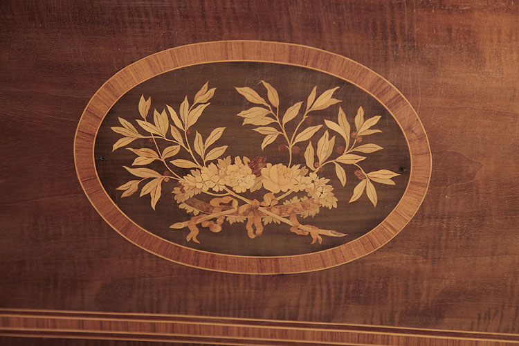 Broadwood inlaid panel featuring a floral head dress and foliage