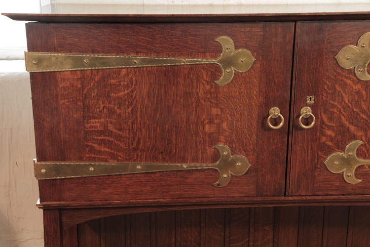 Broadwood oak cabinet with studded brass strap hinges