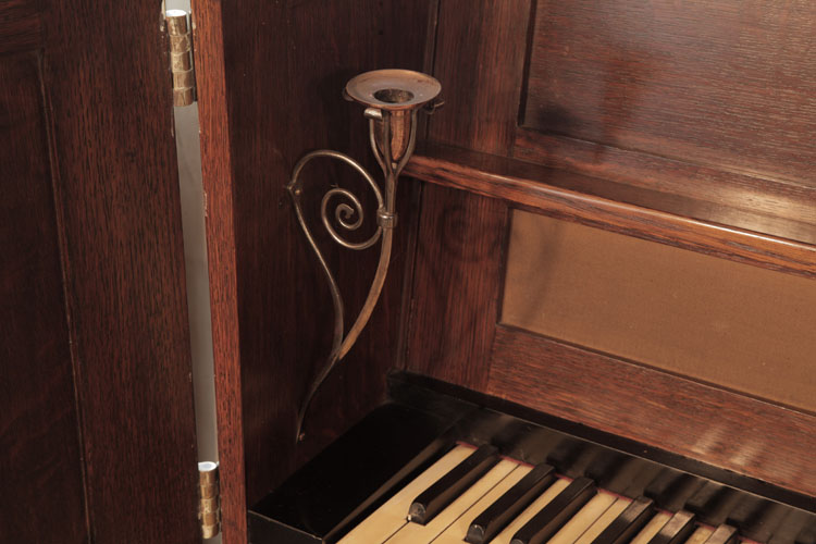 Broadwood wrought steel piano candlesticks in a stylised flower stem design