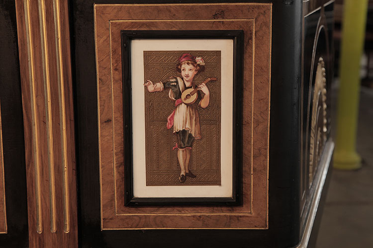Hand-painted porcelain tile mounted on piano cabinet edged with a black border and gold embossed, patterned background. Tile depicts a young boy in a red hat playing a lute