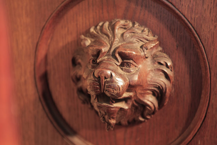 Francke carved lions head on the side cabinet