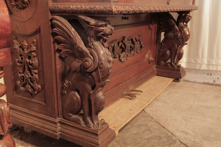 Francke piano legs  carved with seated griffins with outstretched wings
