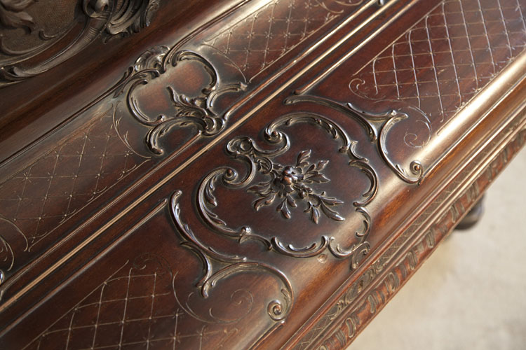 Francke piano fall featuring carved mouldings of flowers and scrolling acanthus 