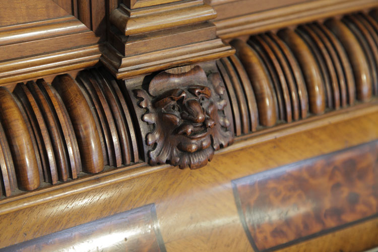 Cabinet detail featuring grotesque heads