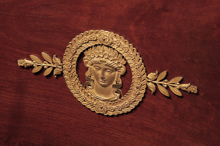 Ibach cabinet ormolu mount featuring a crowned, greek female in a circular laurel wreath with corn stalks