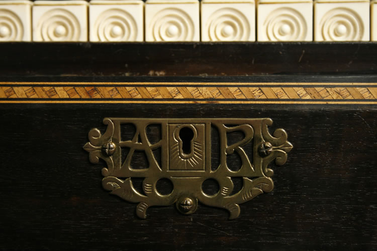 Ornate keyhole escutcheon bears the initials 