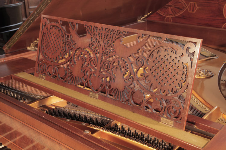 Schiedmayer Arts and Crafts style music desk featuring folkloric motifs including stylised birds, flowers, hearts, tendrils and a central tree