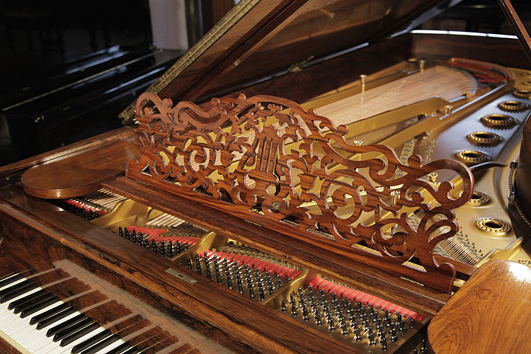 Steinway Model D filigree music desk in a scrolling arabesque design with central lyre motif