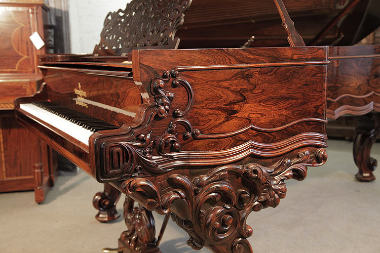Steinway Model D piano cheek detail featuring a Classical meander and carved acanthus in high relief