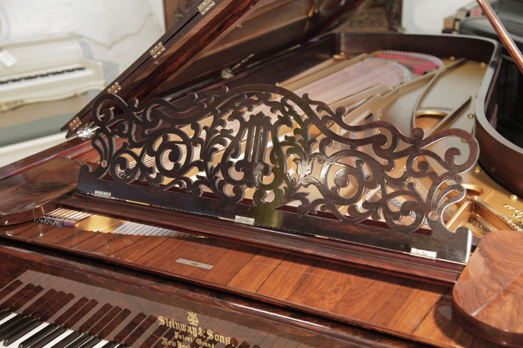 Steinway Model D   music desk in a filigree design of stylised arabesques and a central lyre