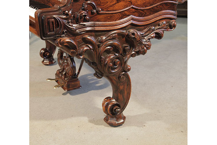 Steinway Model D reverse scroll piano leg carved with foliage in high relief and hidden casters