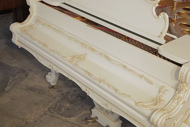 Piano fall with scrolling acanthus mouldings in interlocking S-curves and C-curves with gilt accents