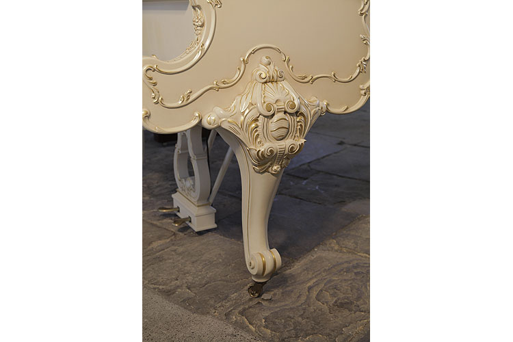 Steinway model O cabriole piano leg with scroll feet ornately, carved with anthemions, cabuchons and scrolling foliage with gilt accents