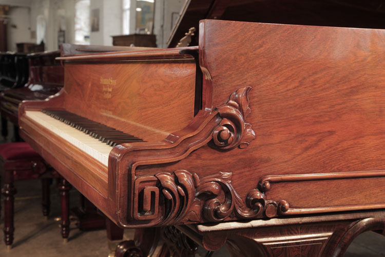 Steinway Style 1 grand piano cheek with dual linear case moulding, a carved, Classical meander and acanthus in high relief