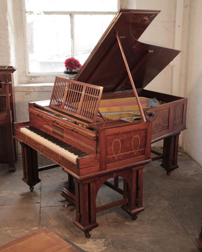 Golden Age of Pianos. Arts and Crafts, Bechstein Model VI grand piano with a mahogany case and copper mounts. Cabinet inlaid with hearts, bellflowers and celtic knotwork. Architectural status given to the piece's raw elements.Biese Hof upright piano for sale with an ornately carved, oak case and griffin legs. Cabinet features openwork panels of carved vines, musical instruments and scrolling acanthus in high relief. A true masterpiece of craftsmanship. 