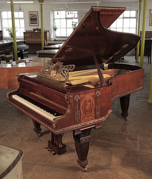 Unique, 1899 Bluthner grand piano with a rosewood case. Cabinet decorated with Art Nouveau and Empire style elements. It was showcased at the 1900 Paris Exposition Universelle. Piano originally the property of Queen Mary, residing at the Ballroom in Malborough Houset