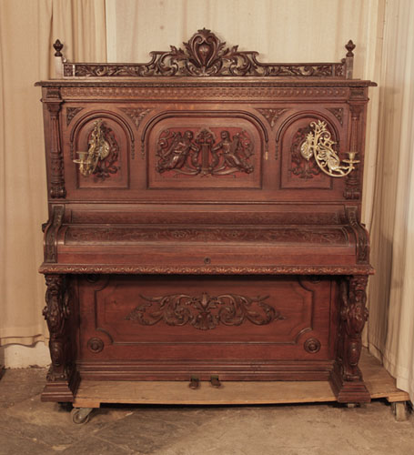 Golden Age of Pianos. Francke upright piano for sale with an oak case. Entire cabinet features Neoclassical style carvings in high relief.