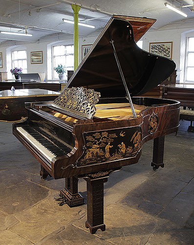 Golden age of pianos. An 1899, Chinese Chippendale style, Schiedmayer grand piano for sale with a stunning, flame mahogany case and Malborough legs with applied fret carvings. Cabinet features oriental scenes in embossed Japanning with gilt ornament.