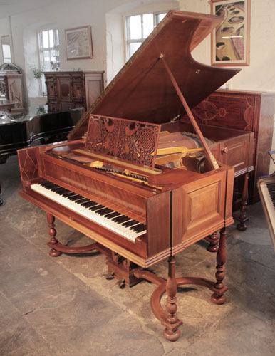 Golden Age of Pianos. A 1912, Schiedmayer model 15 grand piano for sale with a harpsichord style mahogany cabinet and eight baluster legs attached to a cross stretcher