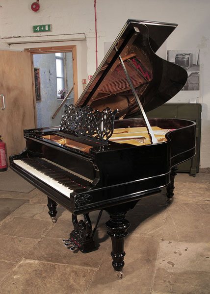 An 1879, Steinway Model A grand piano for sale with a black case, filigree music desk and carved, trumpet  legs. 