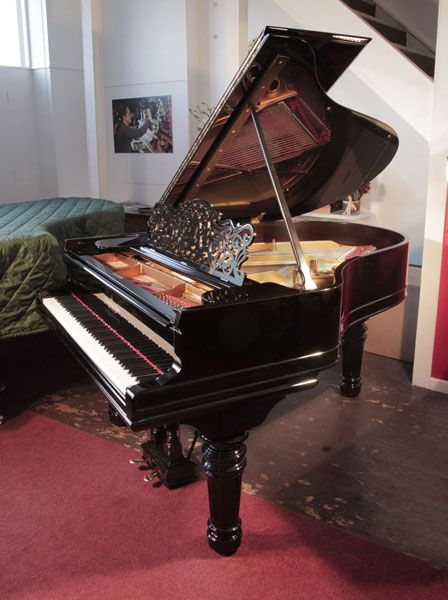 Rebuilt, 1883, Steinway Model A grand piano for sale with a black case, filigree music desk and fluted, barrel legs.