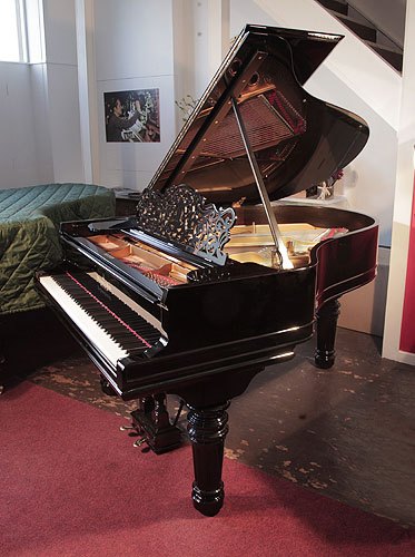 The Golden Age of Pianos. Rebuilt, 1883, Steinway Model A grand piano for sale with a black case, filigree music desk and fluted, barrel legs