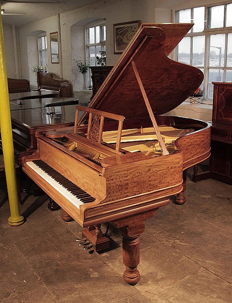 An 1898, Steinway Model A grand piano for sale with a fiddleback mahogany case and barrel legs Piano has an eighty-eight note keyboard and a three-pedal lyre.
