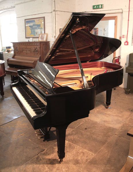 Reconditioned, 1975, Steinway Model B Steinway Model B grand piano for sale with a black case and spade legs 