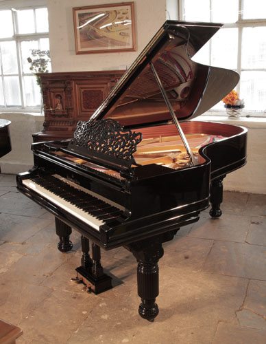 The Golden Age of Pianos. Rebuilt, 1886, Steinway Model B grand piano for sale with a black case, filigree music desk and fluted barrel legs