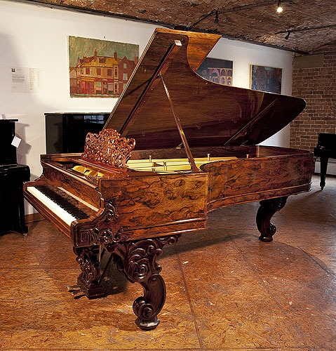 A stunning, 1877, Steinway & Sons Model D concert grand piano with an exquisite wood case and reverse scroll legs