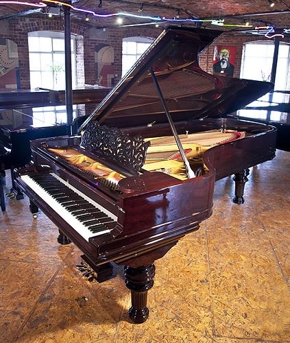 The Golden Age of Pianos. A rebuilt, 1886, Steinway & Sons Model D concert grand piano with a rosewood case, filigree music desk and turned, fluted legs.