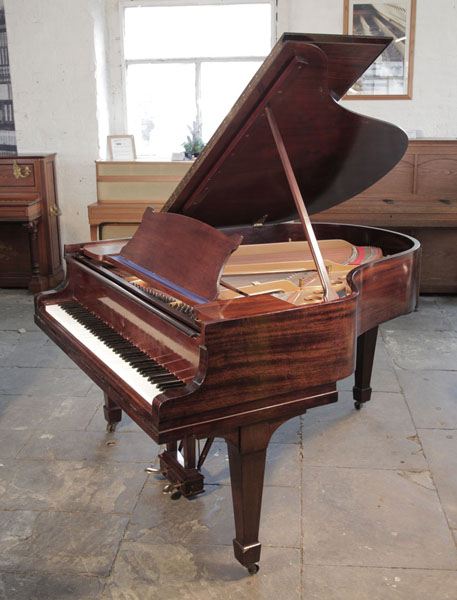 Reconditioned, 1930,  Steinway Model M grand piano with a polished, mahogany case and spade legs