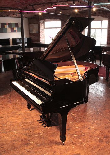 The Golden Age of Pianos. Rebuilt, 1932, Steinway Model M grand piano for sale with a black case and spade legs