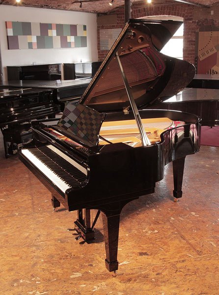 Rebuilt, 1956, Steinway Model M grand piano for sale with a black case and spade legs