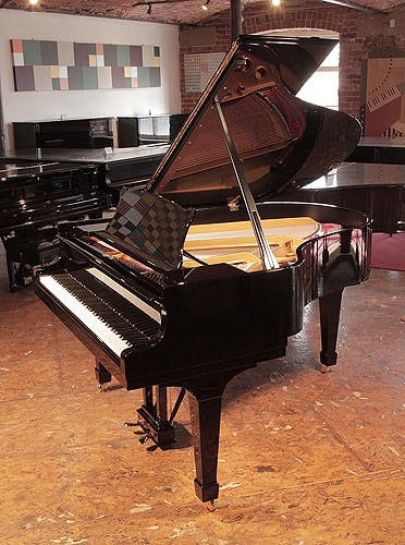 The Golden Age of Pianos. Rebuilt, 1956, Steinway Model M grand piano for sale with a black case and spade legs