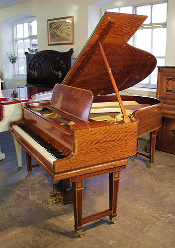 Golden age of pianos. Stunning, 1906 Steinway Model O grand piano with a polished, satinwood case and gate legs. Entire cabinet inlaid with boxwood stringing and crossbanding accents.