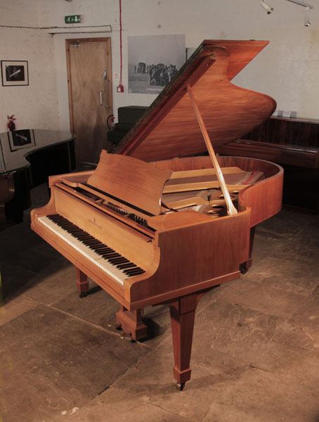 A 1932, Steinway Model O grand piano for sale with a satin, walnut case and spade legs. Piano has an eighty-eight note keyboard and a two-pedal lyre.  