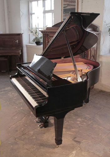 The Golden Age of Pianos. Rebuilt, 1937, Steinway Model S baby grand piano with a black case and spade legs