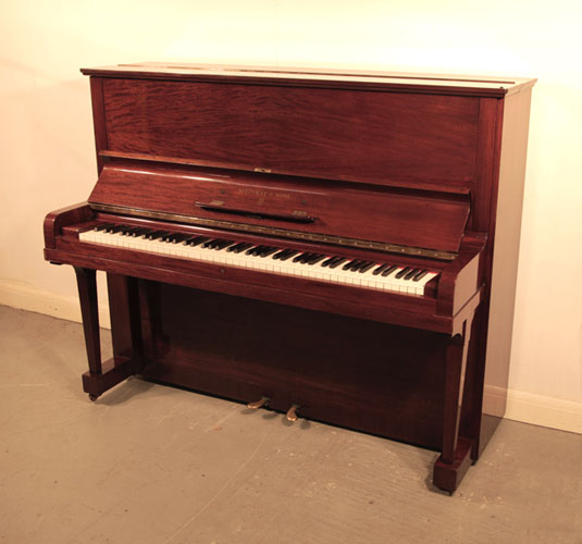 The Golden Age of Pianos. A 1936, Steinway Model V upright piano with a quartered, mahogany case and brass fittings