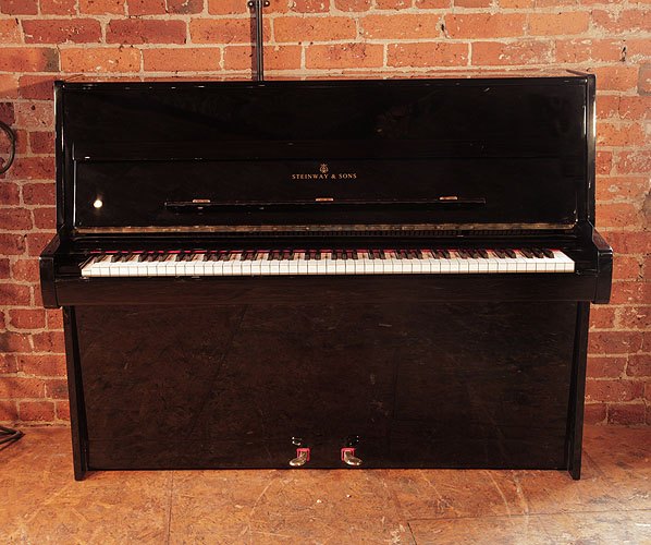 Golden Age of Pianos. Reconditioned, 1981, Steinway Model Z upright piano with a black case and brass fittings