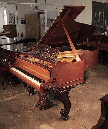 Golden Age of Pianos. Restored, 1877, Steinway & Sons Style 1 grand piano for sale with a Rococo style, rosewood case, filigree music desk and ornately carved, reverse scroll legs