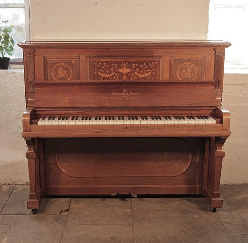 The Golden Age of Pianos. A 1904, Steinway upright piano for sale with a polished, rosewood case and inlaid panels in a Neoclassical design